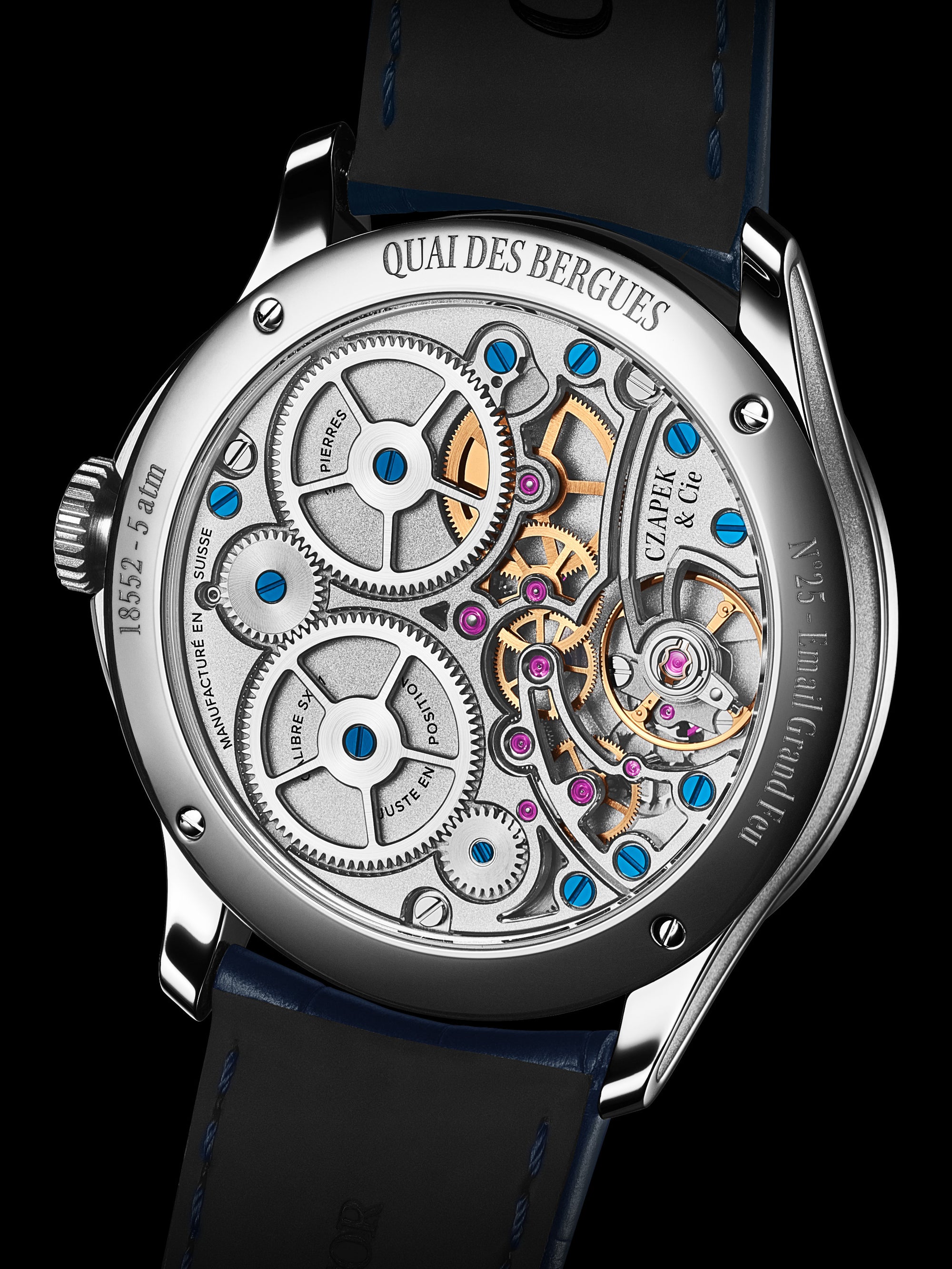 Luxury watch with visible mechanical components on a black background