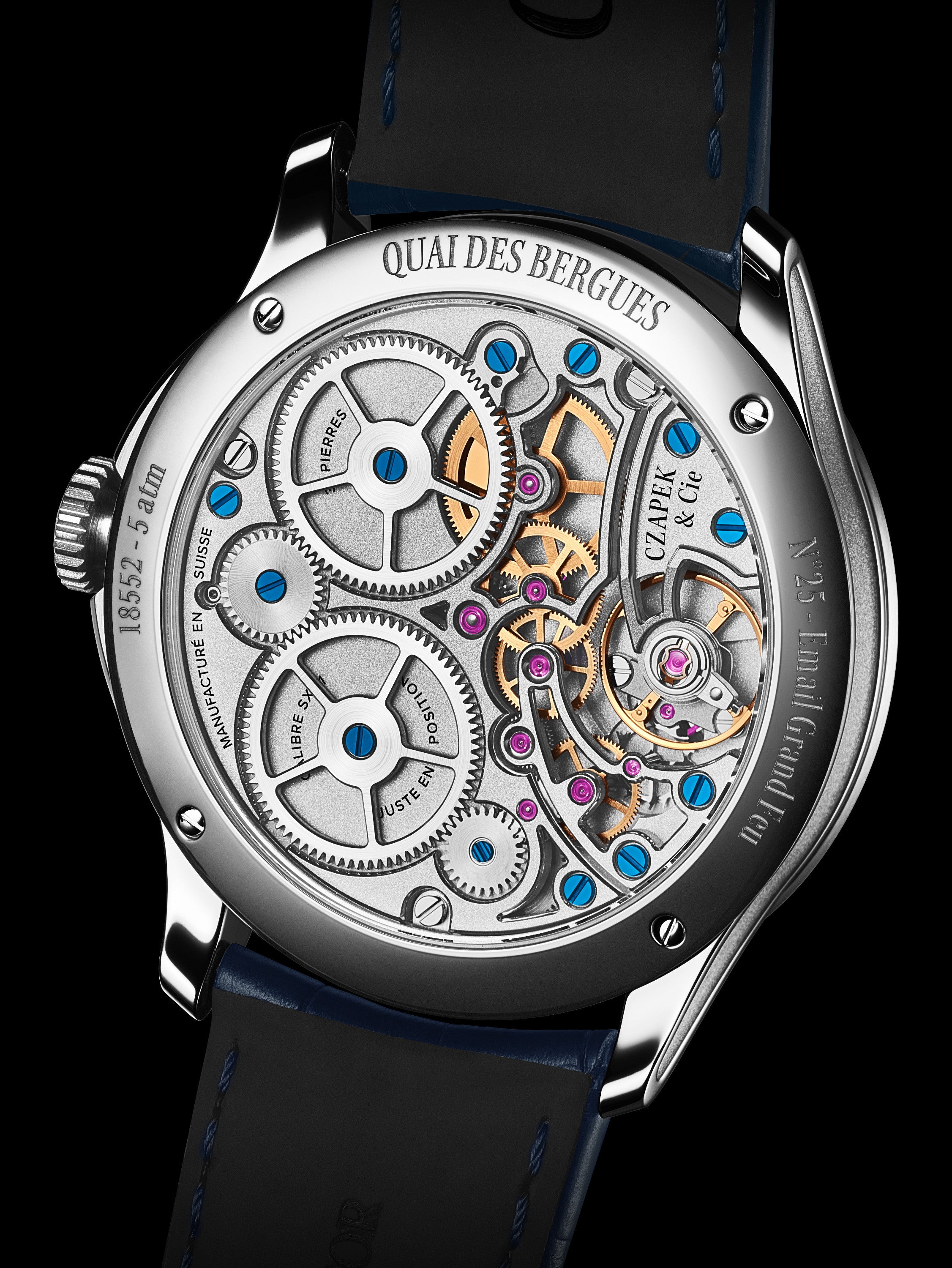 Luxury watch with visible mechanical components on a black background